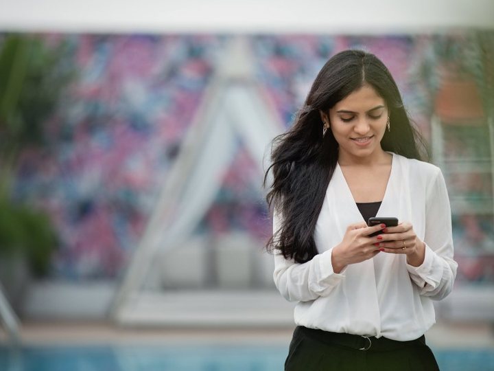 A member holding a phone